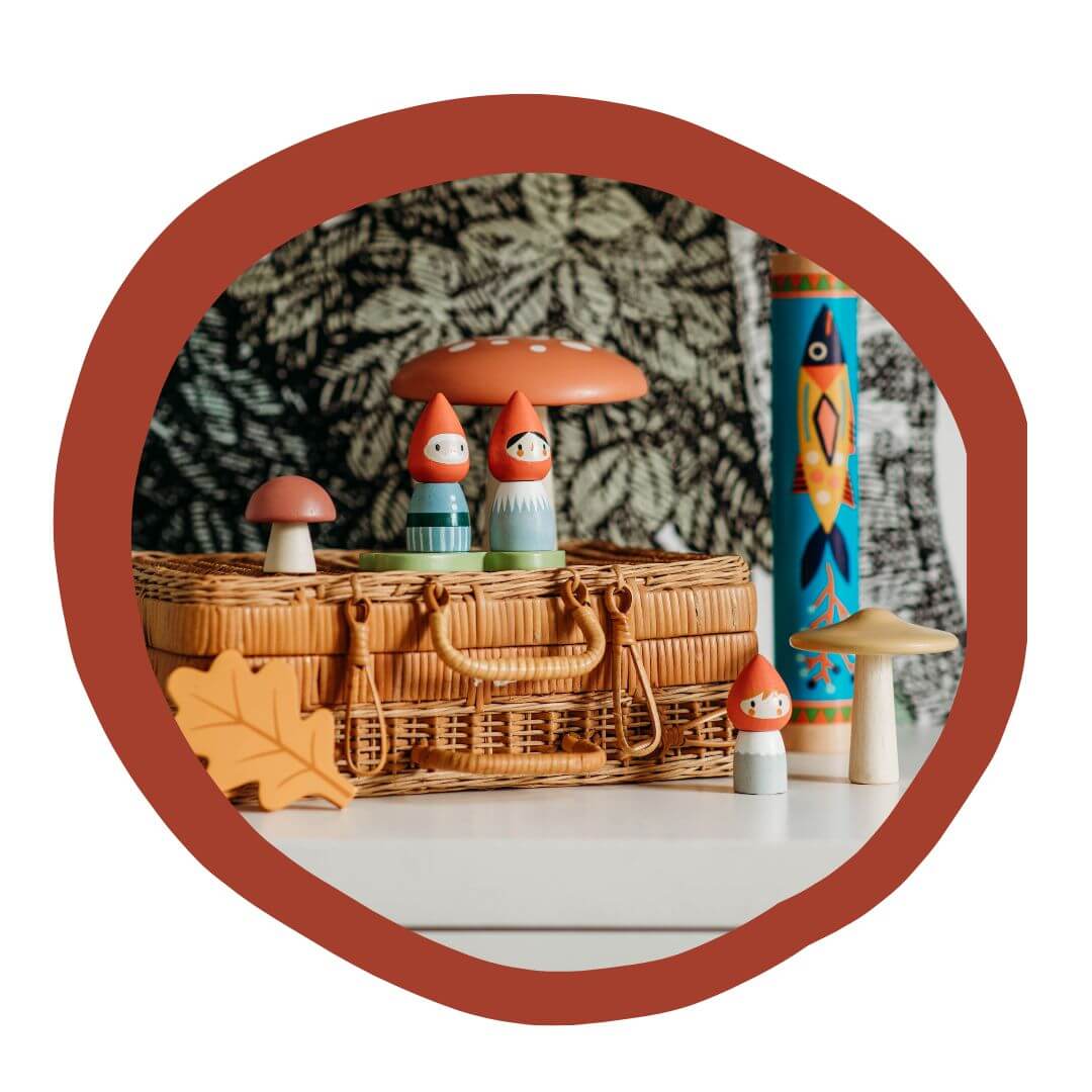 Tender Leaf Toys gnomes on a wicker basket