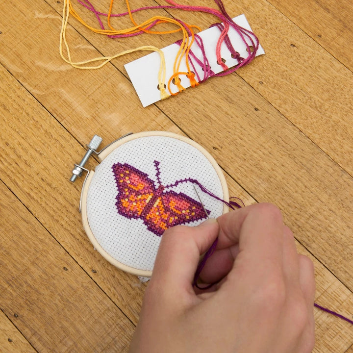 Child cross stitching with Mini Cross-Stitch Embroidery Butterfly Kit - Bella Luna Toys