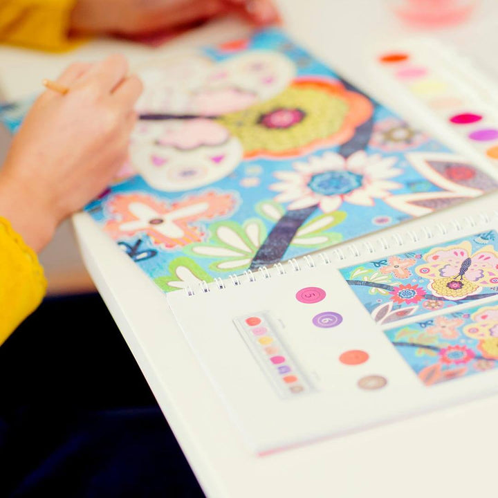 Girl coloring in Djeco Multi-Activity Flower Creativity Kit