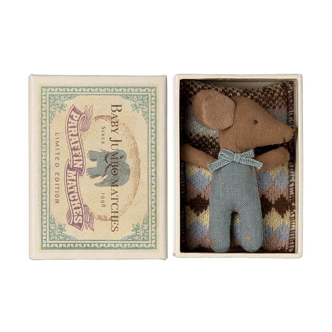 Maileg Sleepy Wakey Baby Mouse in a Matchbox in blue on top of covers