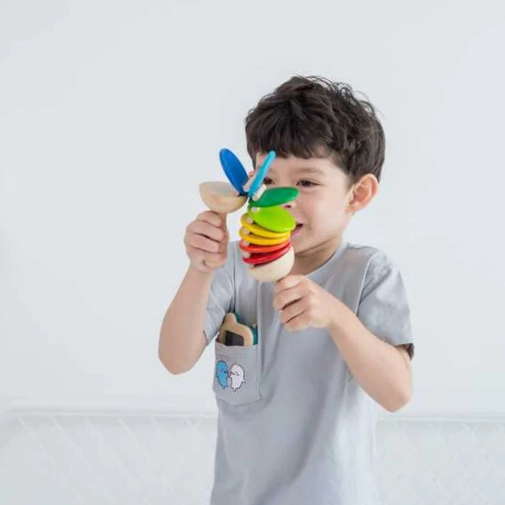 Plan Toys, Clatter, Musical Toys - Child playing with rainbow clatter toy| Bella Luna Toys