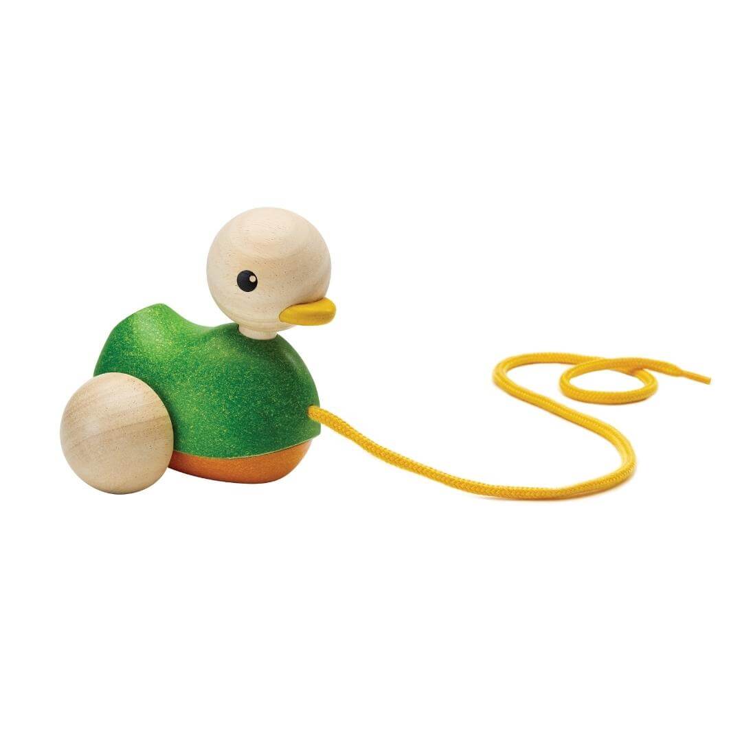 PlanToys Montessori Pull-Along Duck in green with natural wood head, yellow beak, and yellow pull cord, designed for toddlers to walk and play.