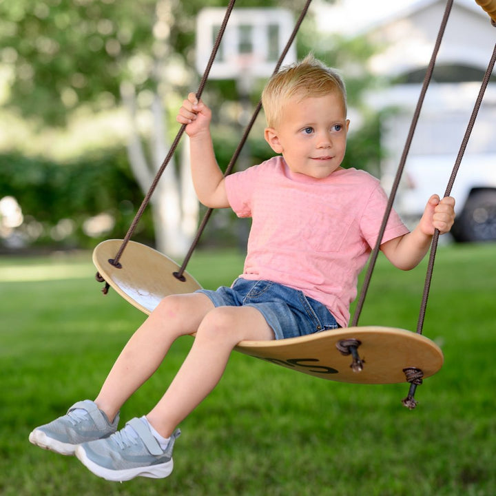 Swurfer-Child playing on wooden outdoor swing- Bella Luna Toys