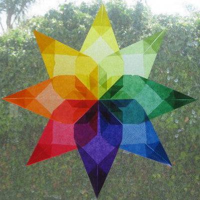 Rainbow colored window star paper on window