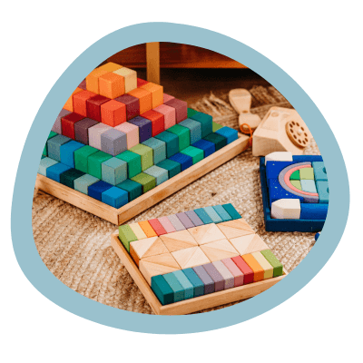 Collection of wooden blocks on a rug.
