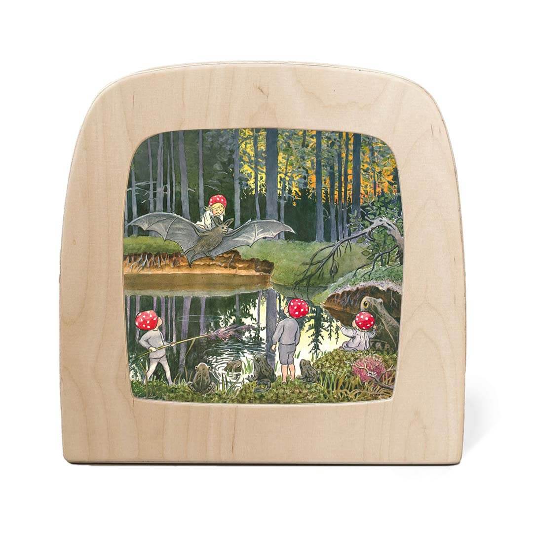Wooden light with a nature-themed collage featuring children and animals in a forest setting.