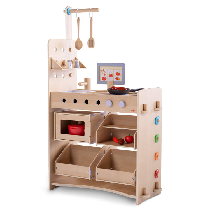 Creative Play 3 in 1 – Play Kitchen, Store & Workshop wooden play set with various accessories on a white background