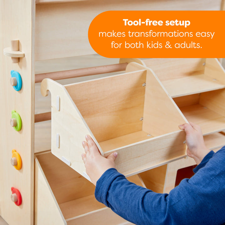 Wooden toy structure with colorful knobs, being assembled by a person, with text about tool-free setup.