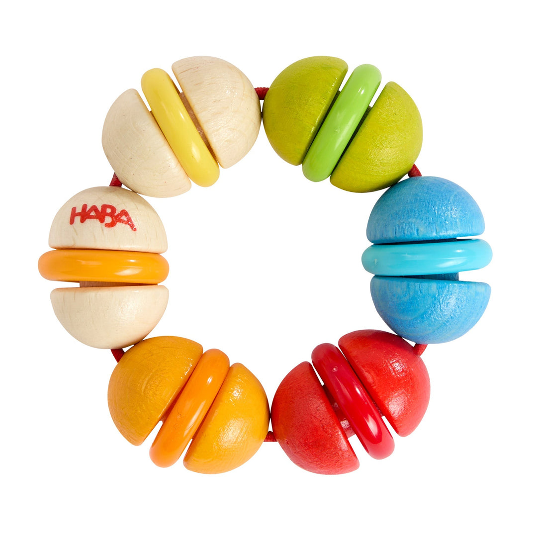 Rainbow Rattle Grasping and Teething Toy from HABA -  A vibrant wooden baby rattle that encourages early motor skills, sensory play, and gentle teething. Sustainably crafted with smooth wood and child-safe finishes.