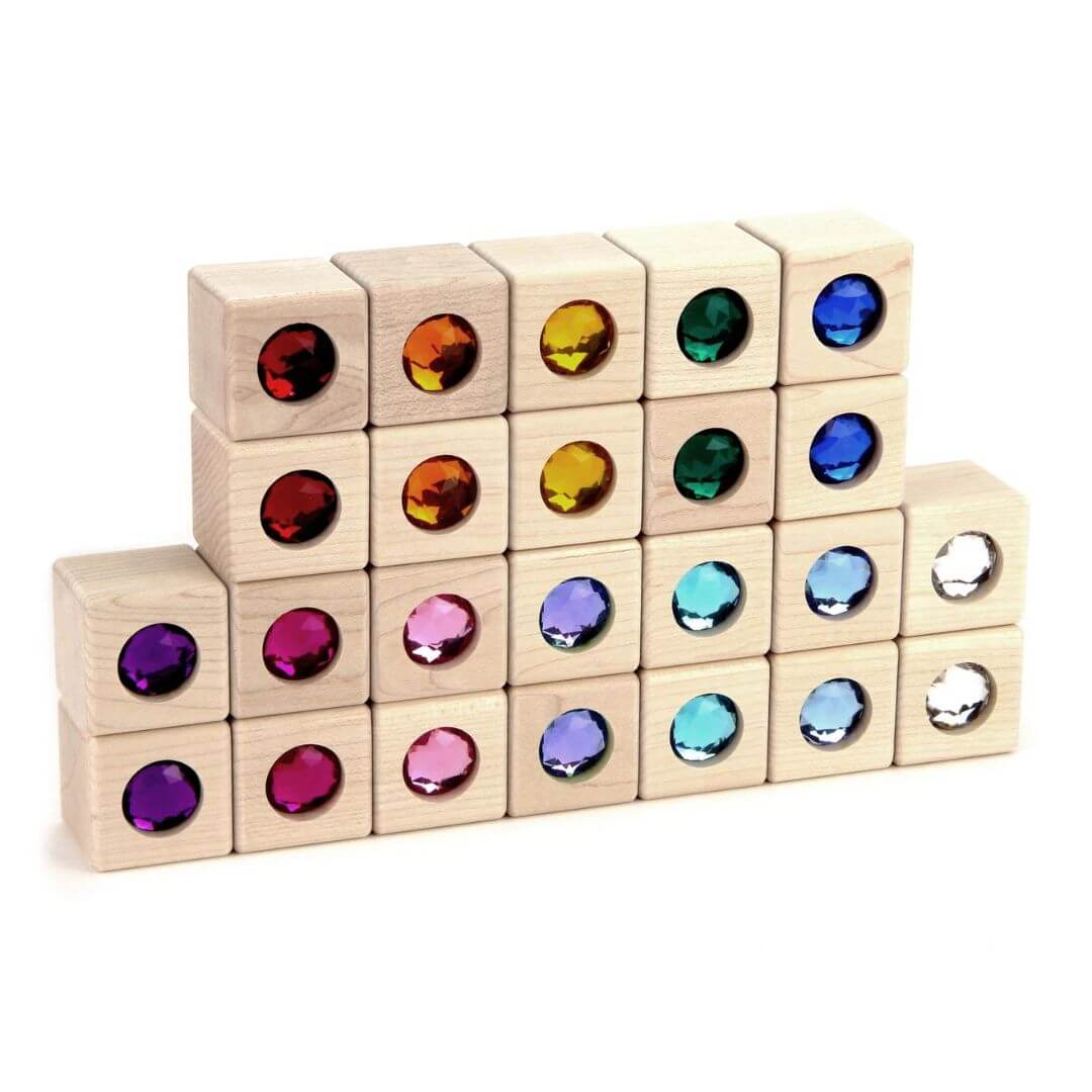 Everwood Friends natural maple building blocks with colorful inset acrylic gems stacked up 4 rows high.