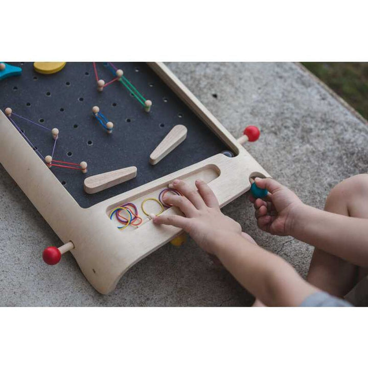 Child pull ball projector on PlanToys - Wooden Pinball Game Set