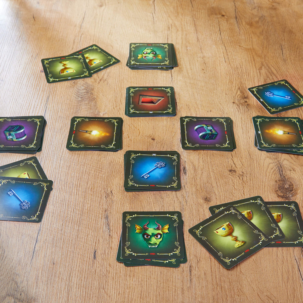 Collection of fantasy-themed cards on a wooden surface