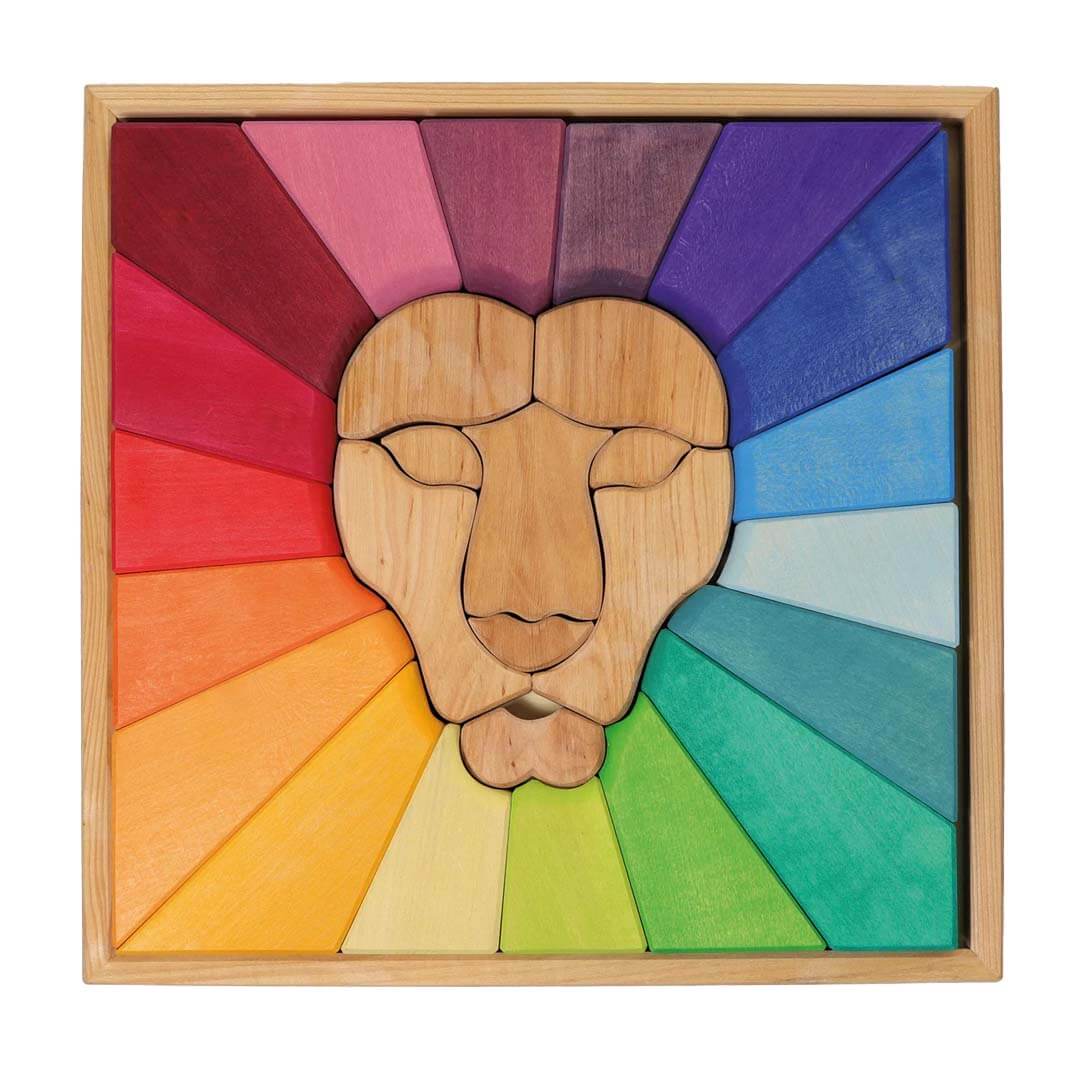 Wooden lion head puzzle on a white background.