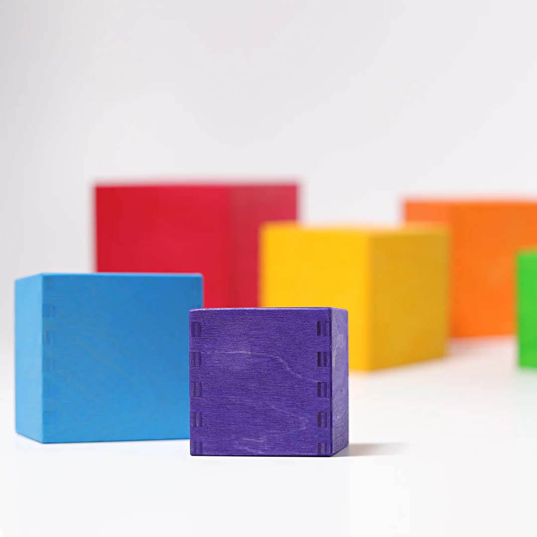 Colorful wooden blocks on a white background.