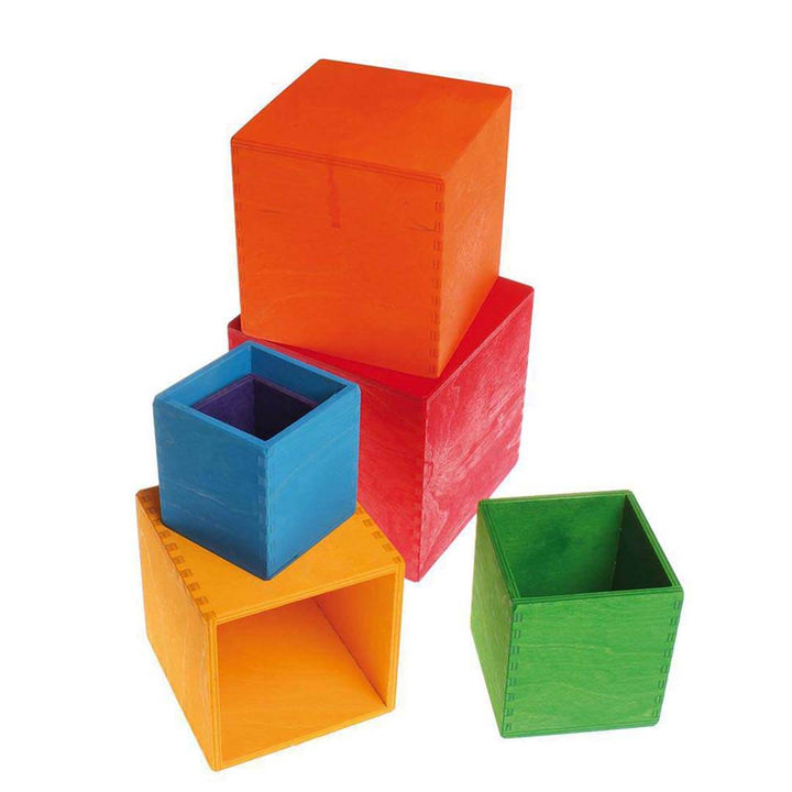 Stack of colorful building blocks on a white background.