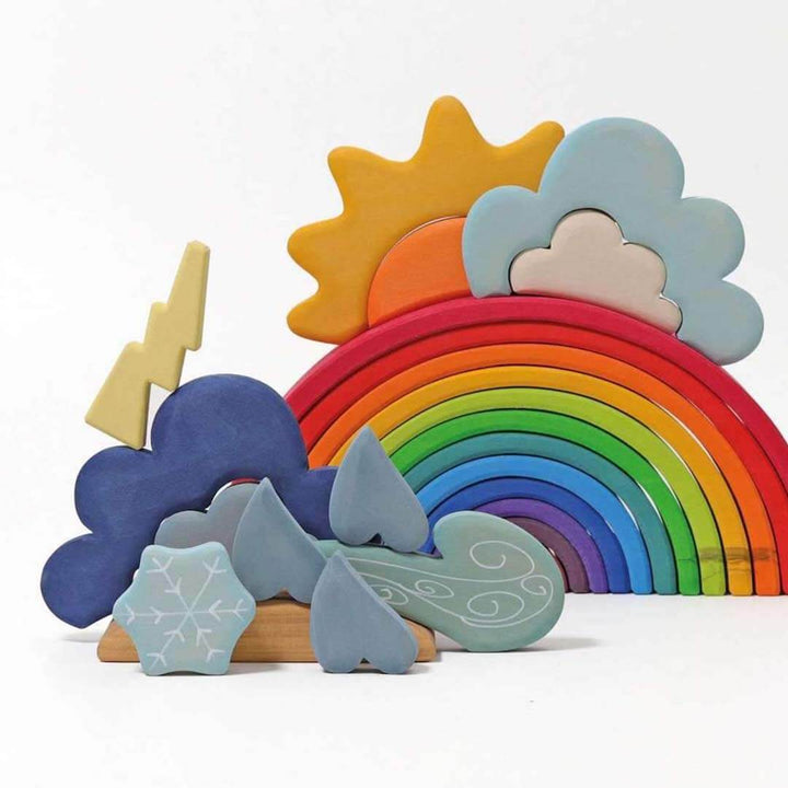 Colorful wooden weather set with rainbow, sun, clouds, and lightning bolt on a white background.