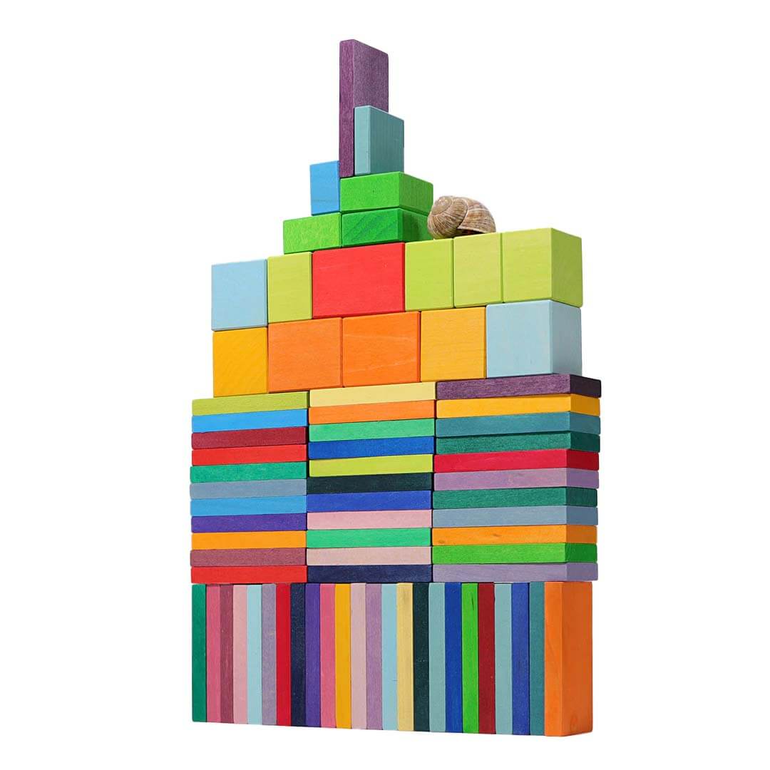 Stack of colorful building blocks on a white background.