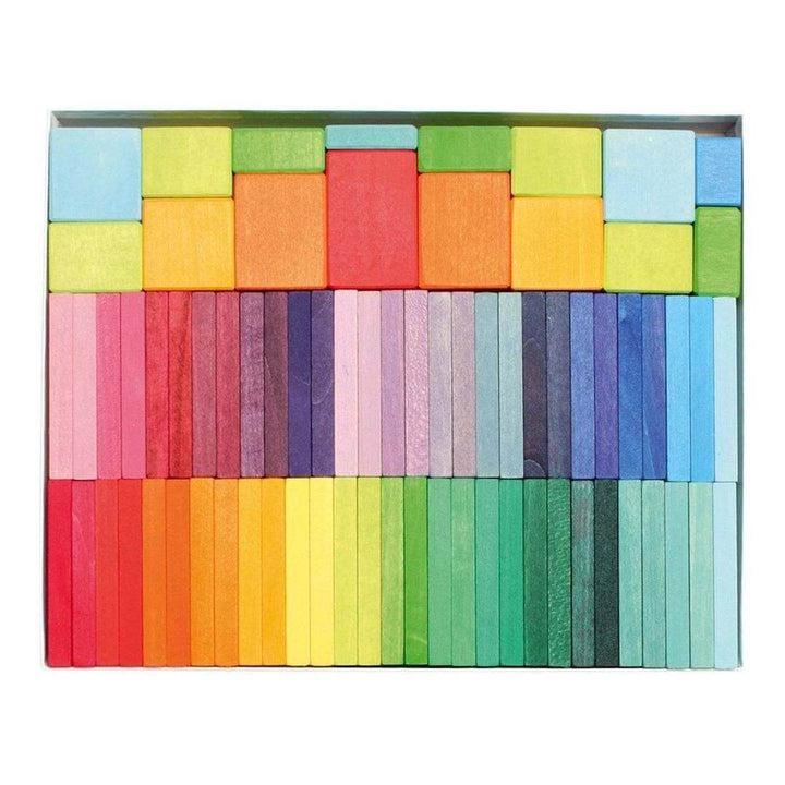 Colorful wooden blocks arranged in a grid pattern on a white background.