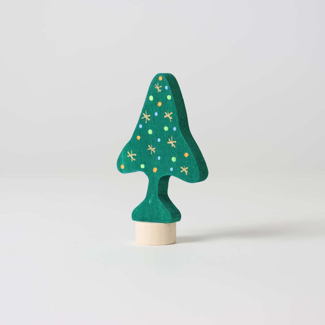 Green wooden Christmas tree ornament with gold stars on a white background