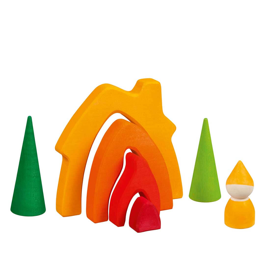 A set of colorful wooden toy blocks for children, featuring a rainbow arch with red, orange, and yellow layers, two green cone trees, and a small yellow-and-white gnome figure, all on a plain white background -Bella Luna Toys