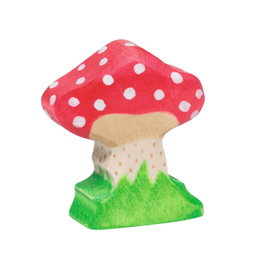 A small wooden toy mushroom figurine with a red cap, white polka dots, a natural wood stem, and a green base, isolated on a white background - Bella Luna Toys