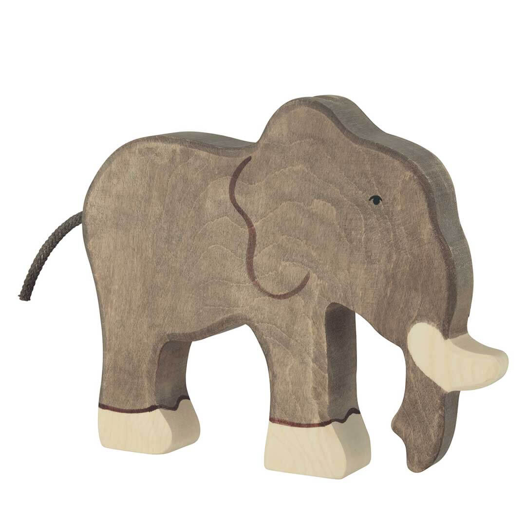 A wooden elephant toy with a textured gray-brown body, light beige tusks and feet, and a dark brown trunk, shown on a plain white background.