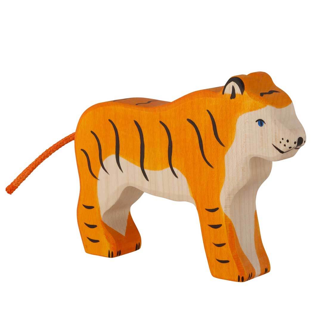 A handcrafted wooden tiger toy with orange and beige painted wood, black stripes, and a small orange tail, shown on a solid white background.