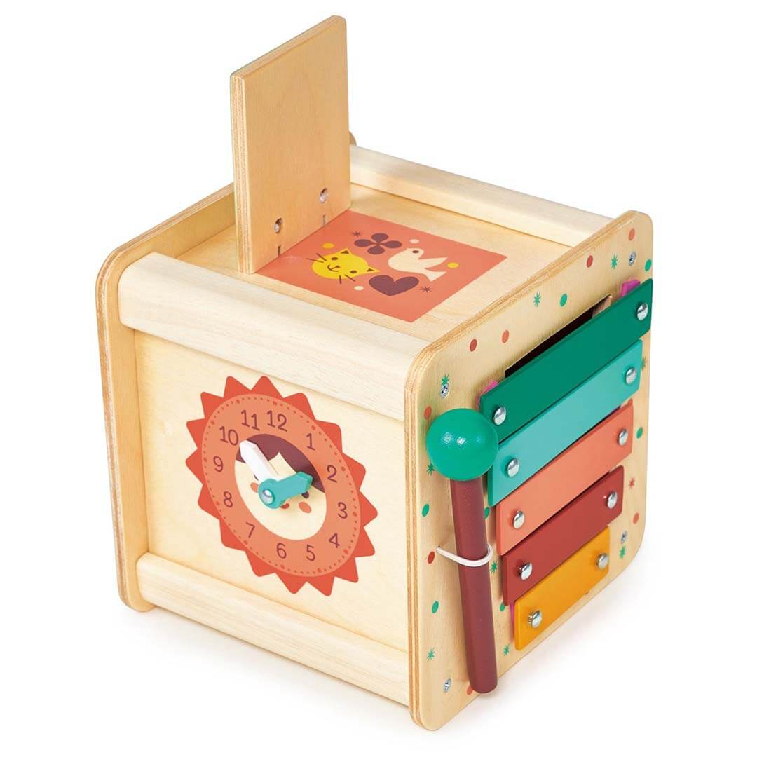 Wooden toy with colorful panels and a clock design on a white background