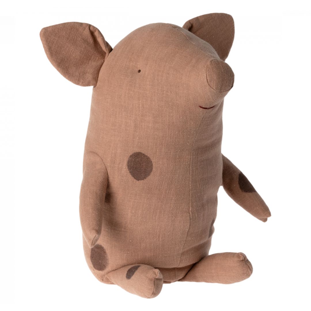 A pink Maileg pig stuffed animal with light brown spots.