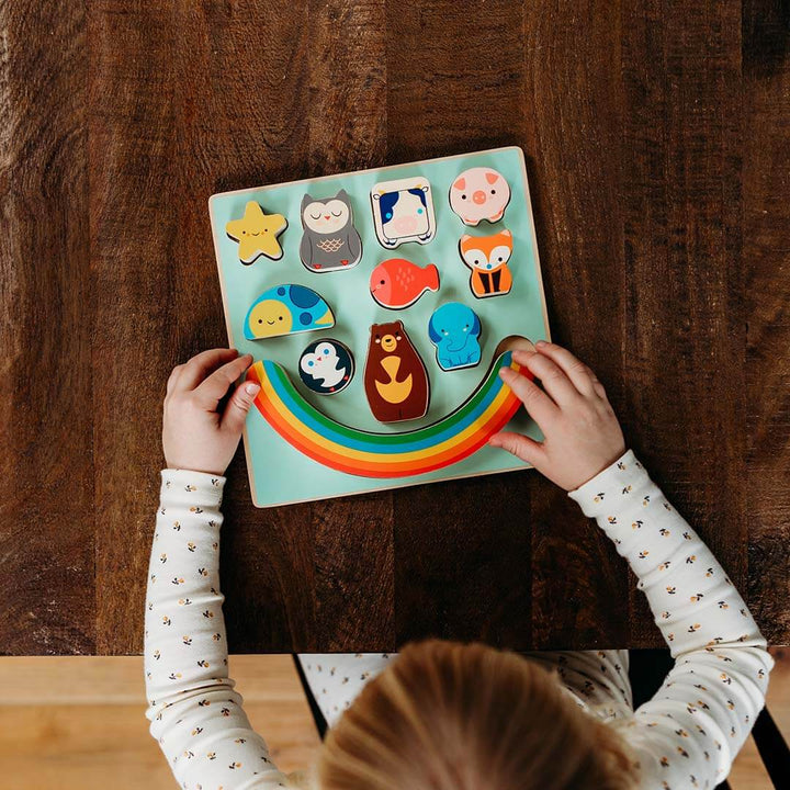 Puzz & Boom Animal Rainbow Wooden Puzzle on a wooden table.