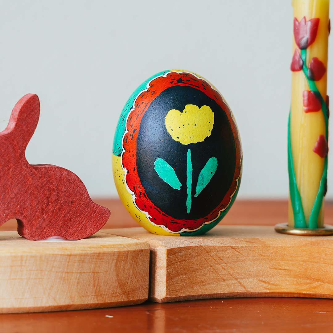 A Kid's Guide to Decorating Ukrainian Easter Eggs Kit used to create a tulip egg.