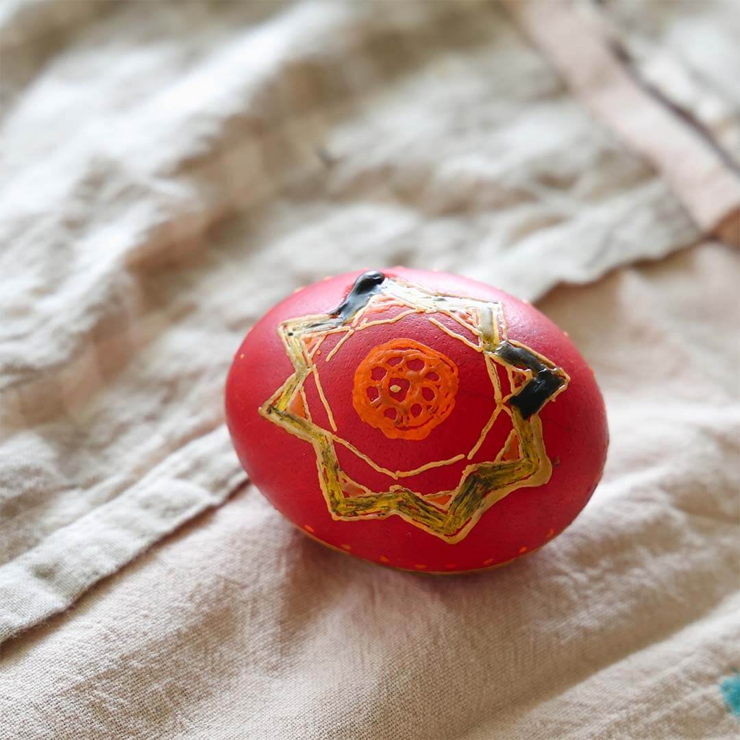 A Kid's Guide to Decorating Ukrainian Easter Eggs Kit being used to create an egg.