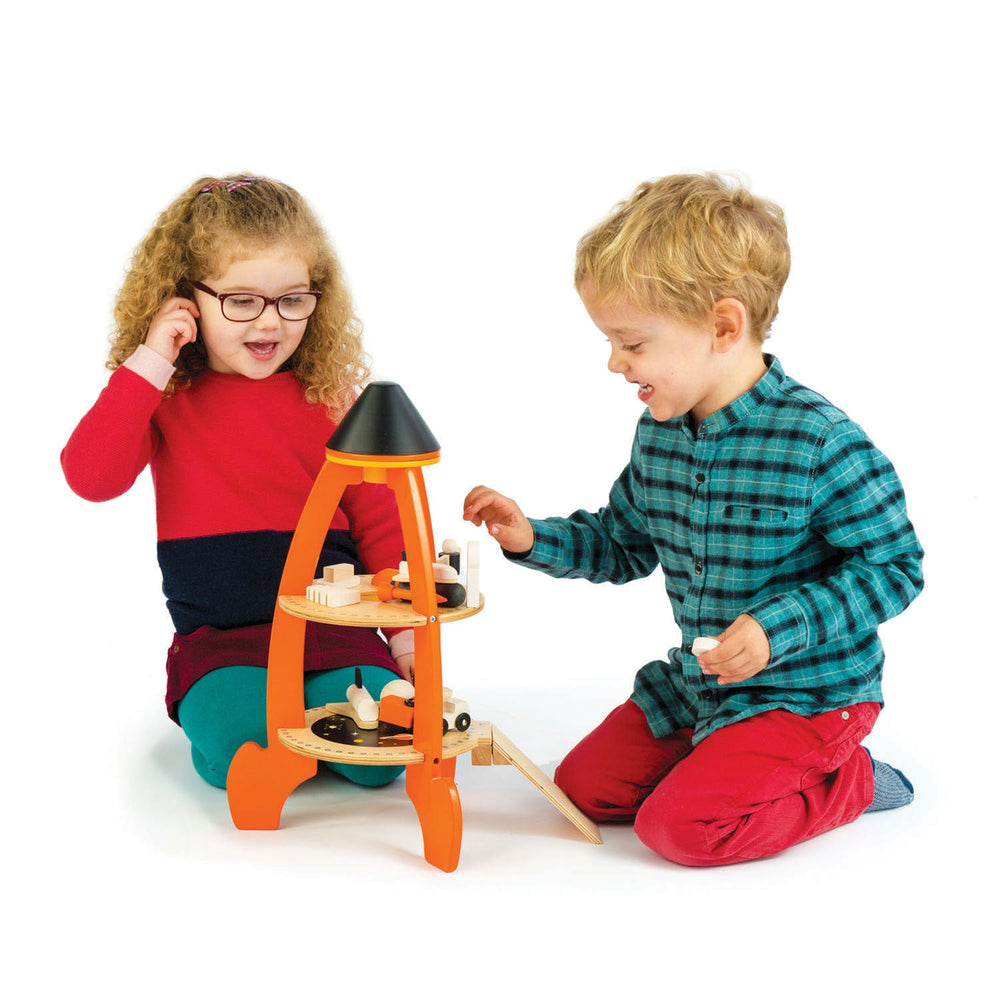 Kids playing with Tender Leaf Toys Cosmic Wooden Rocket Play Set