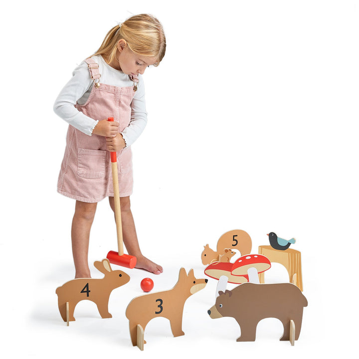 Kid playing with Tender Leaf Toys Woodland Indoor Wooden Croquet Set