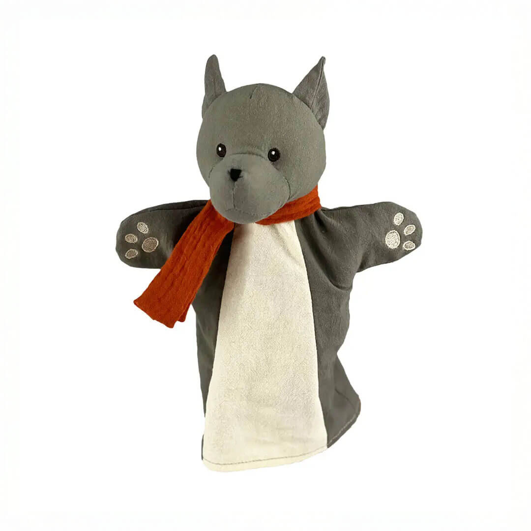 Hand puppet of a wolf with a red scarf on a white background