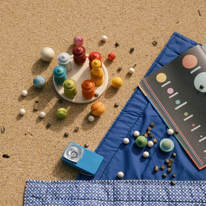 Grapat Dear Universe wooden ball set on beach