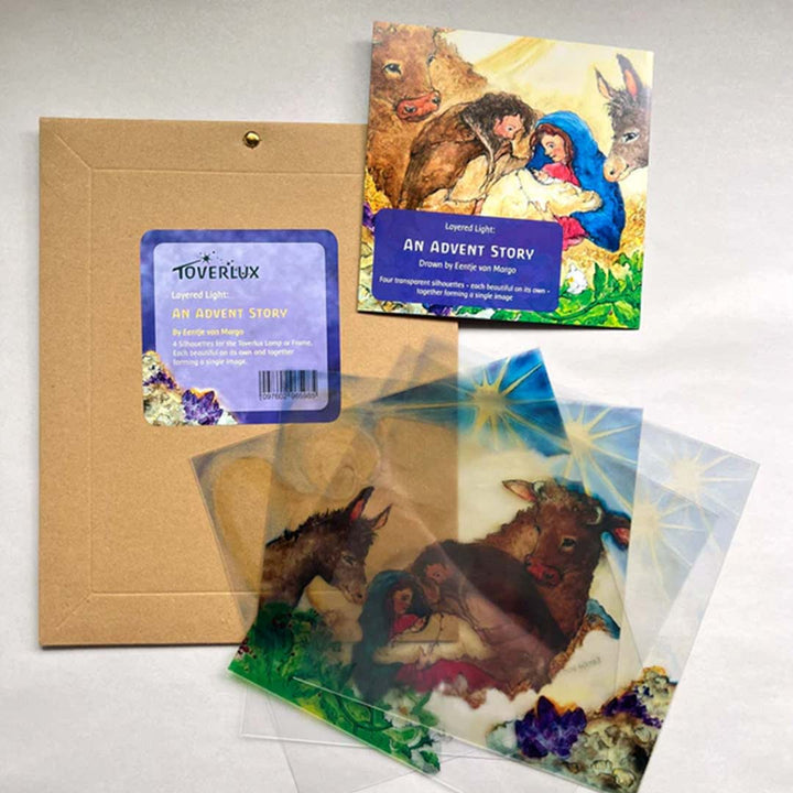 Toverlux Lamp Layered Light Set – “An Advent Story” by Eentje van Margo, showing four translucent silhouettes and packaging with the Holy Family design- Bella Luna Toys