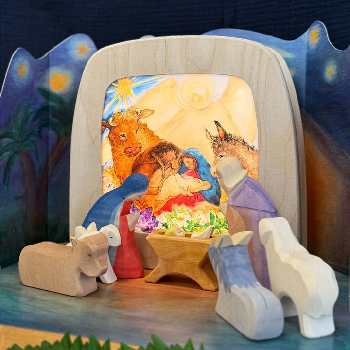 Toverlux Lamp Layered Light Set – “An Advent Story” by Eentje van Margo, showing four translucent silhouettes and packaging with the Holy Family design- Bella Luna Toys