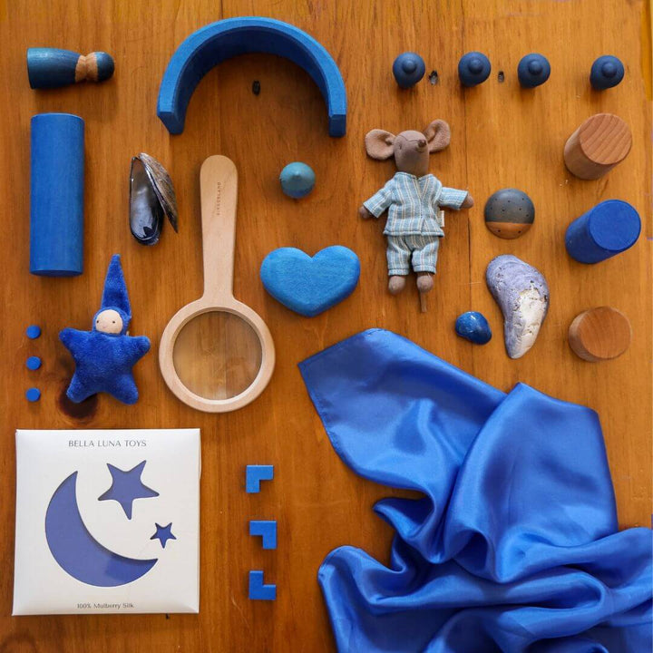 Bella Luna Toys Blue Play Silk with a collection of other blue items.