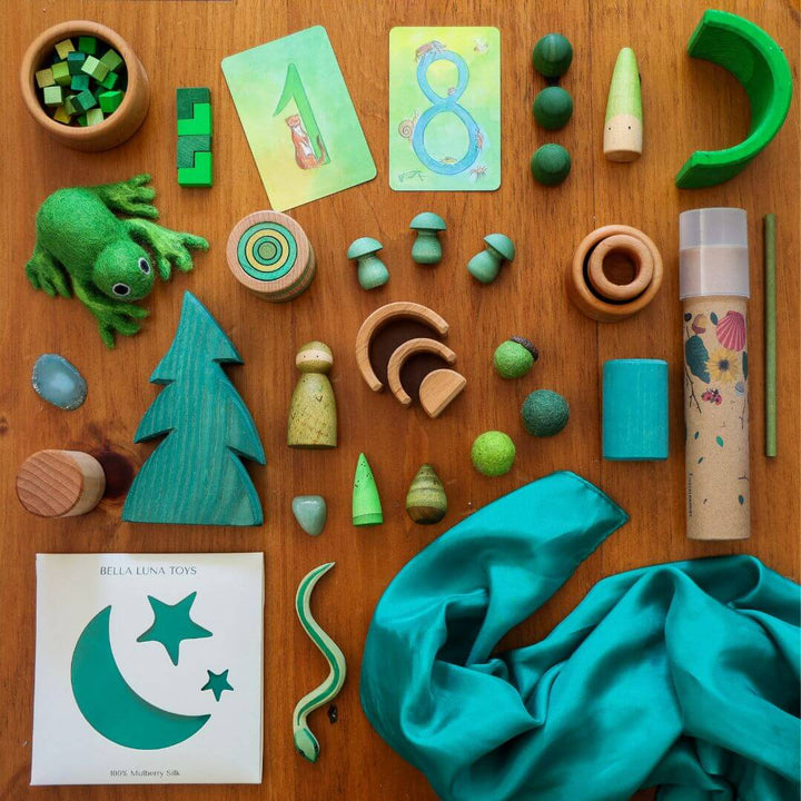 Bella Luna Toys Green Play Silk with a collection of other green items.