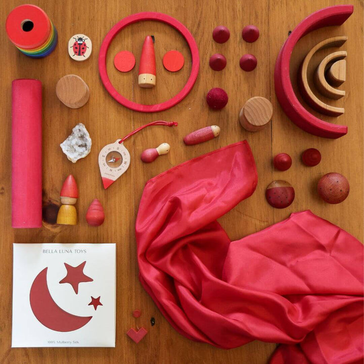 Bella Luna Toys Red Play Silk with a collection of other red items.