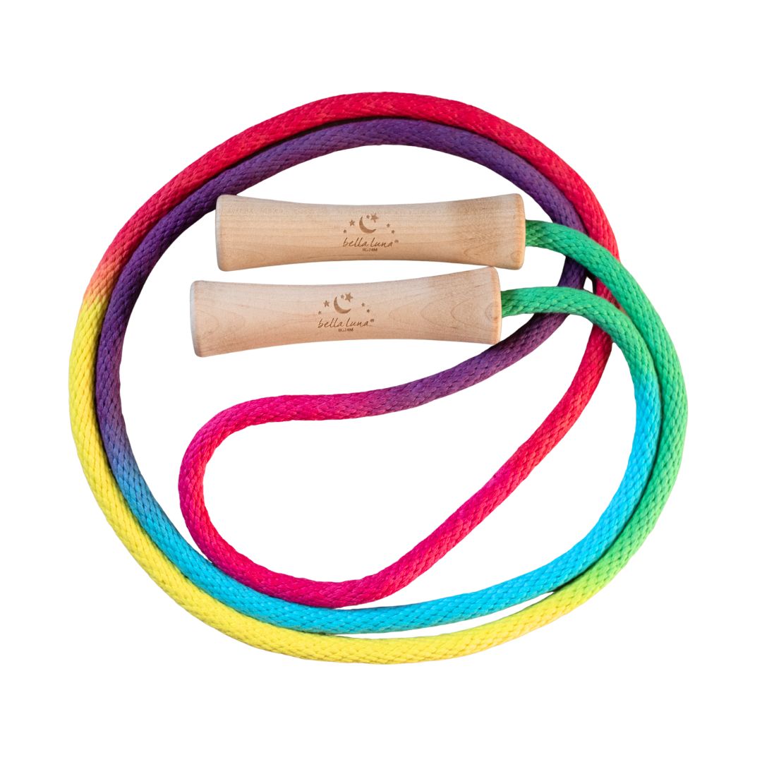 A vibrant, hand-painted Rainbow Jump Rope crafted with smooth wooden handles and sturdy cotton rope, perfect for active, imaginative play against a white background. Bella Luna Toys. 
