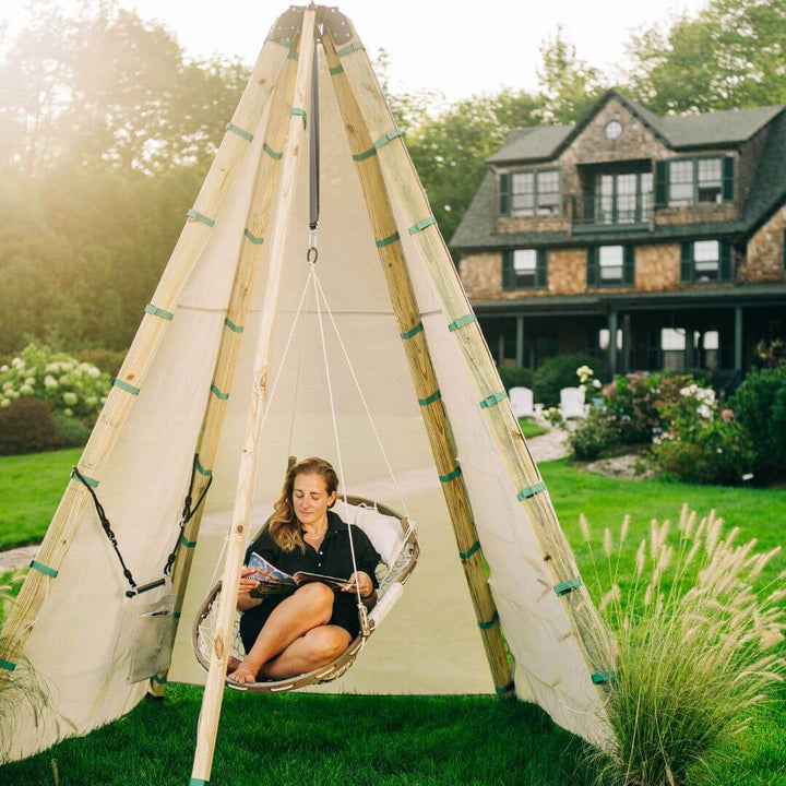 Bijou Build Haven modular tent system with hanging swing in backyard.