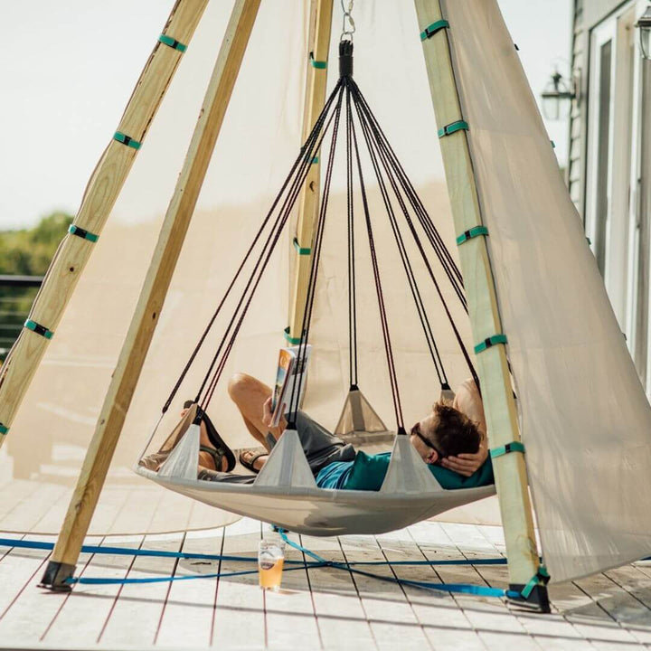 Bijou Build Nest outdoor shelter with suspended 5-foot Hover swing, UV-protective fabric canopy, solar LED lights, and cushions for relaxing outdoors - Bella Luna Toys