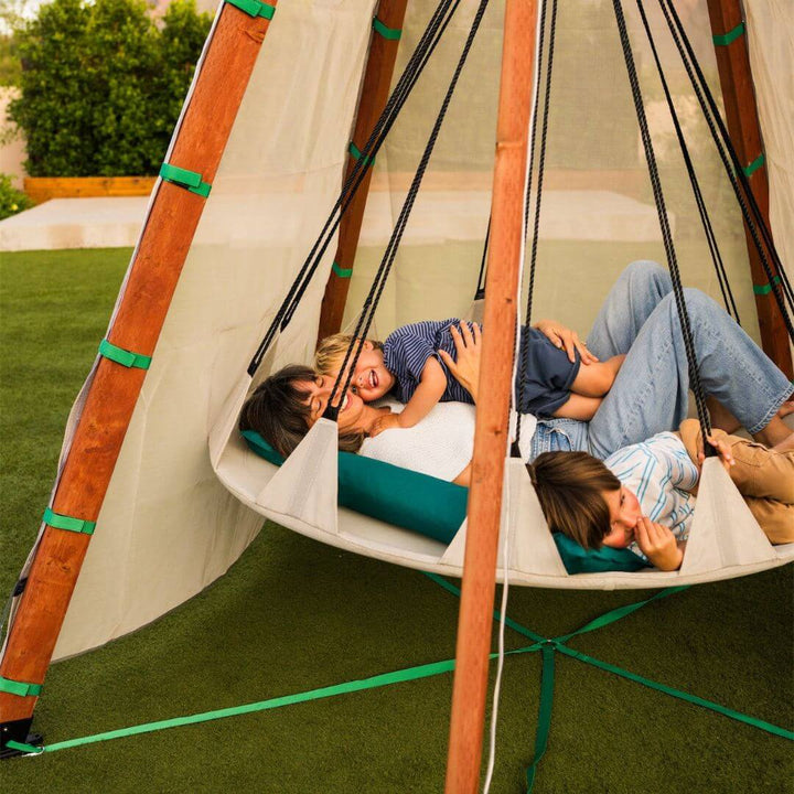 Bijou Build Nest outdoor shelter with suspended 5-foot Hover swing, UV-protective fabric canopy, solar LED lights, and cushions for relaxing outdoors - Bella Luna Toys