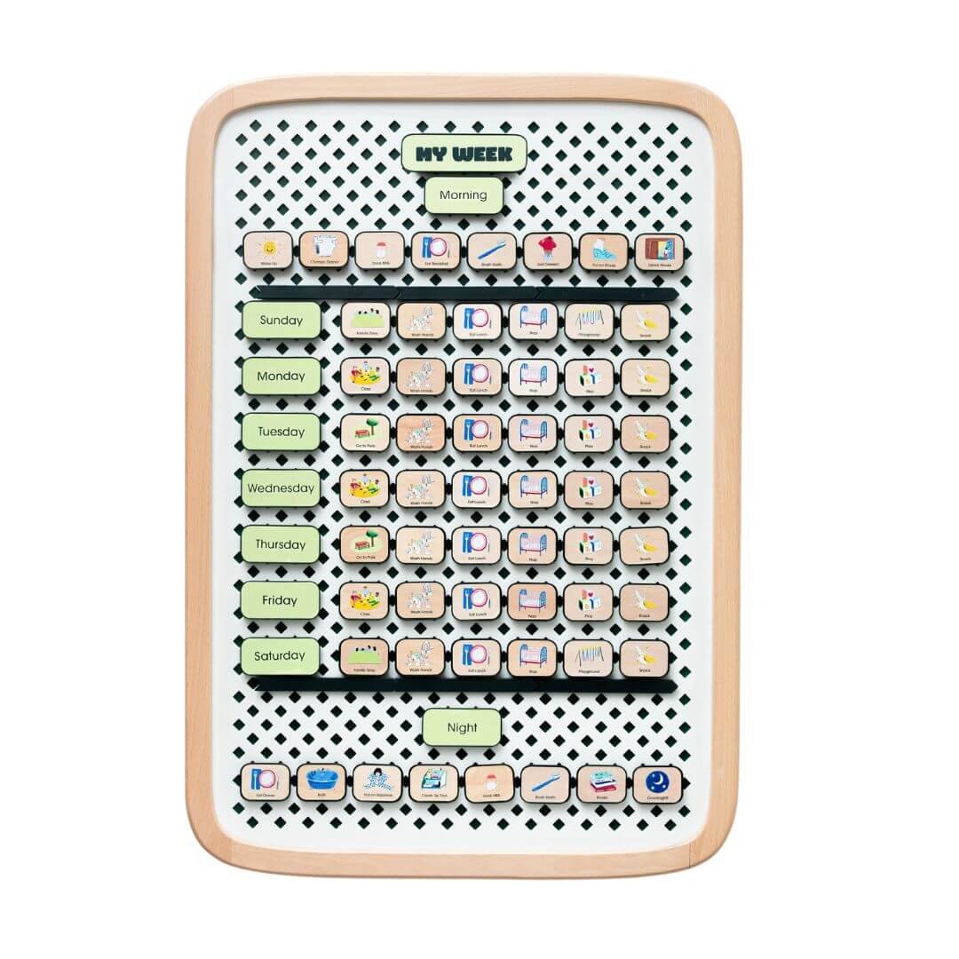 Large wooden Charmspring visual family routine board with picture tiles arranged by days of the week, shown on a white background. Bella Luna Toys