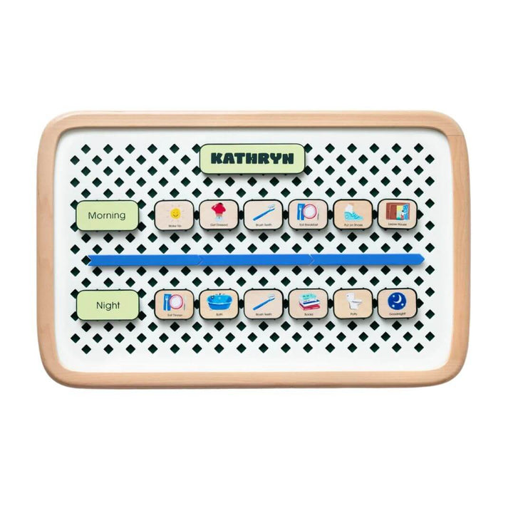 Small Charmspring visual routine board displaying morning and night picture tiles arranged on a patterned backing, shown on a white background. Bella Luna Toys