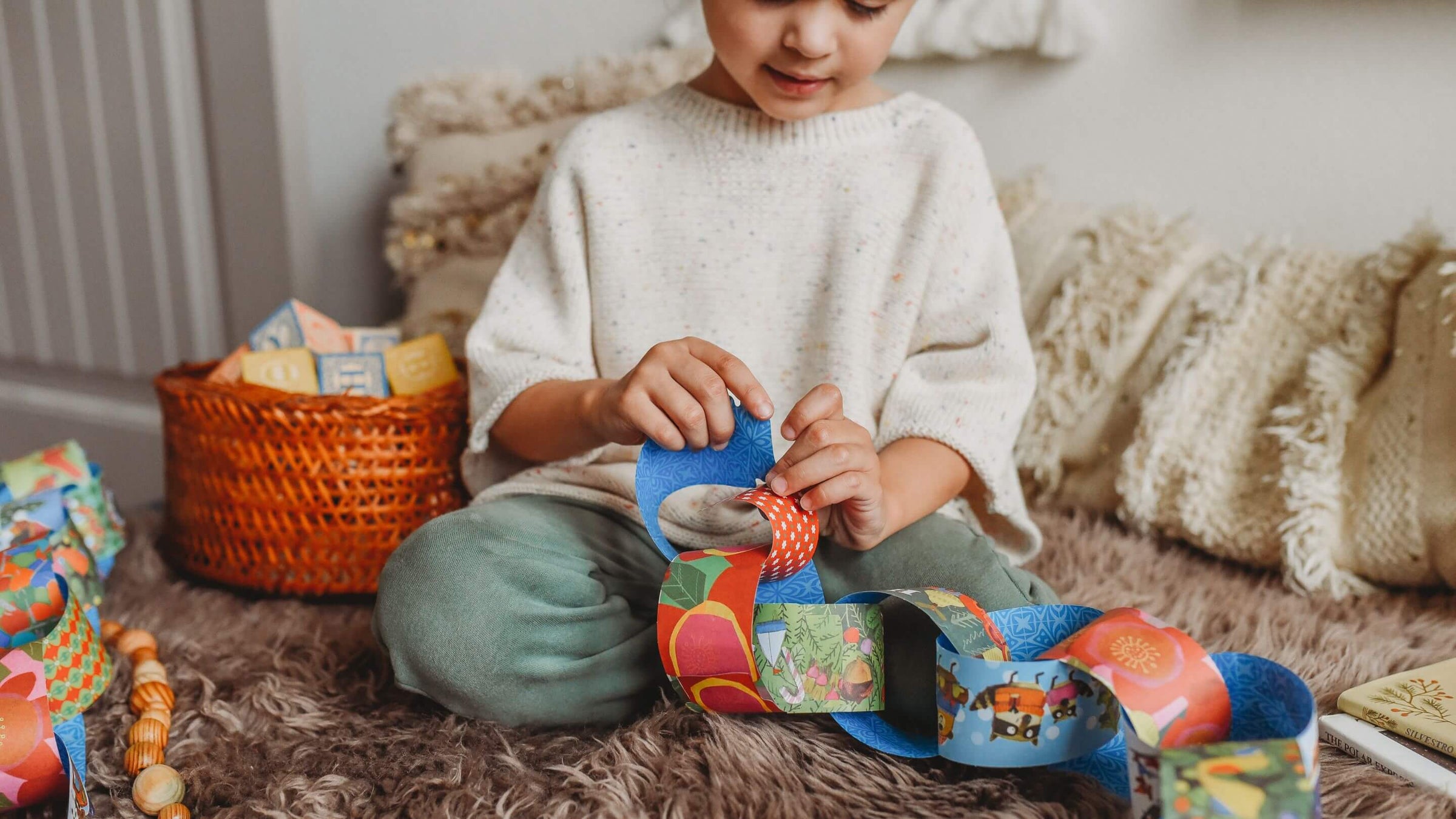 Child playing with a colorful toy on a cozy living room floor.