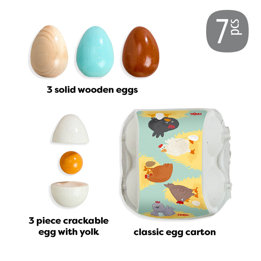 Creative Play – Wooden Eggs Play Food Set of 3 wooden eggs and a crackable egg with yolk, including packaging, on a white background.