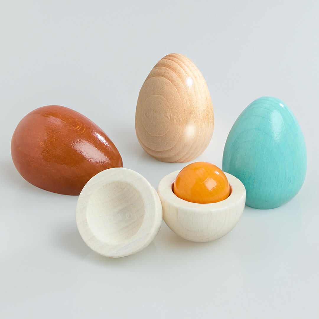 Colorful Wooden Eggs Play Food Set wooden eggs on a light gray background 